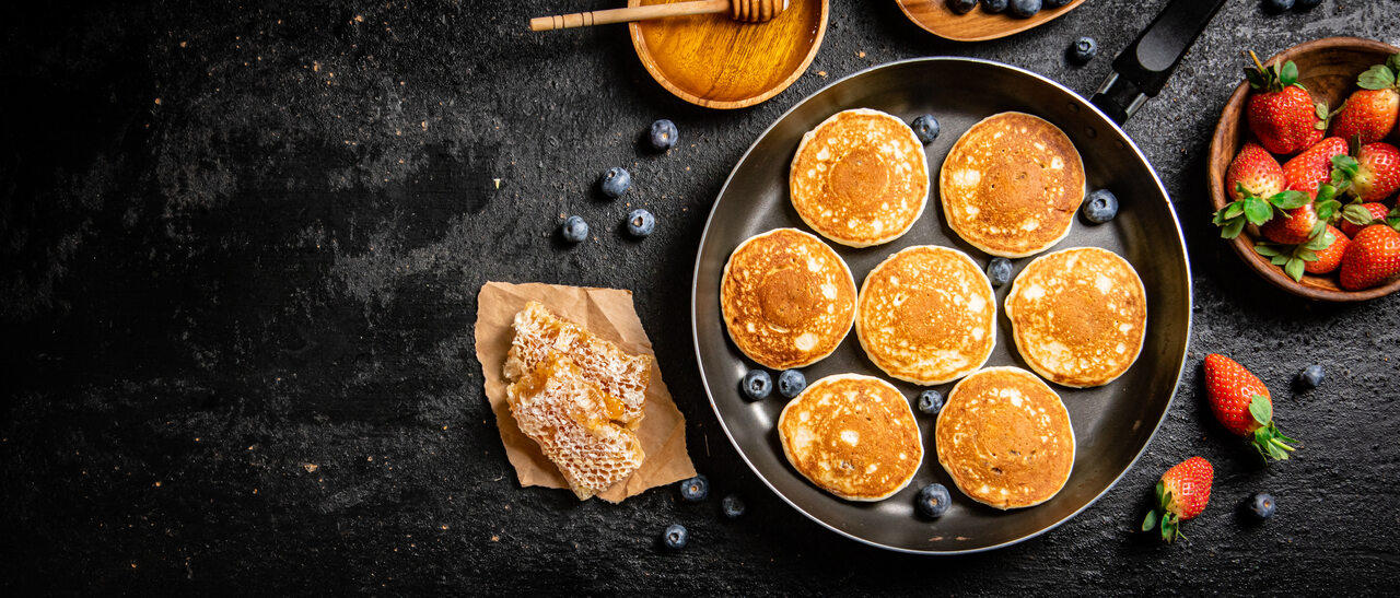 Home 4 pancakes-in-a-frying-pan-with-fresh-berries-and-ho-2024-09-21-05-37-52-utc_Easy-Resize.com